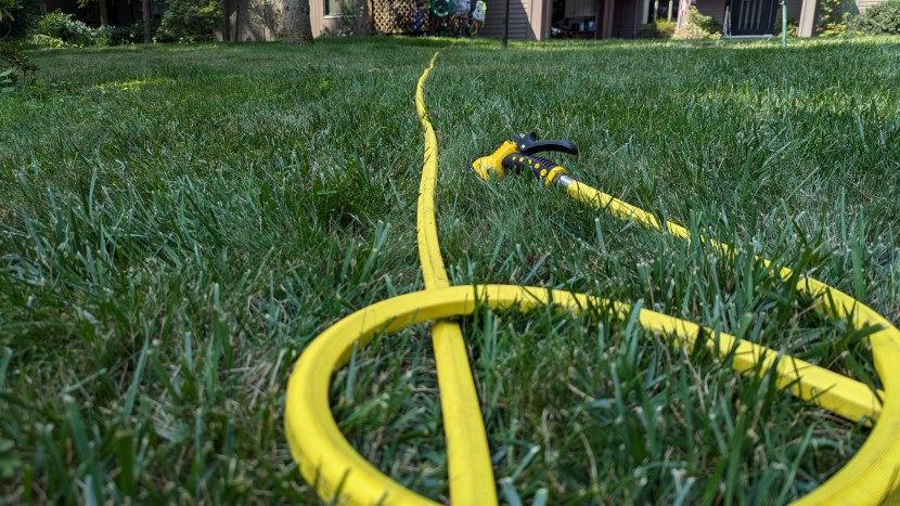 garden hose - even in long grass, the bright dramm hose stands out.