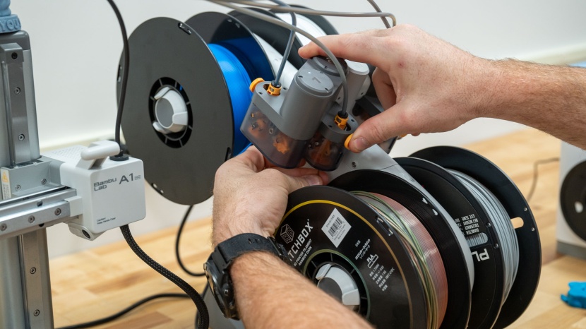 bambu lab a1 mini - the optional ams (automated material system) arm upgrade is a...