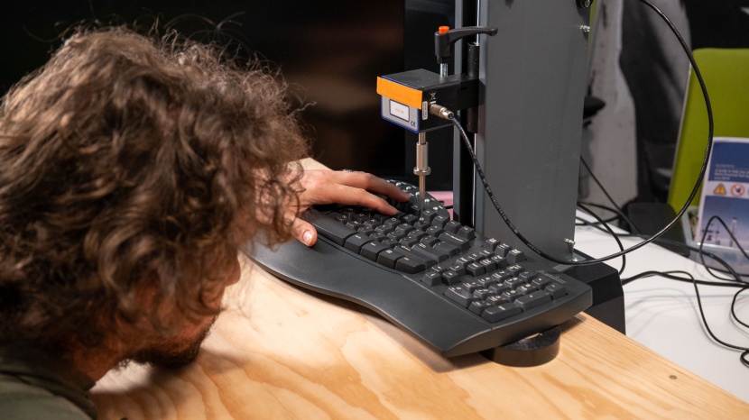 ergonomic keyboard - our force-displacement tester presses down on a key and provides...