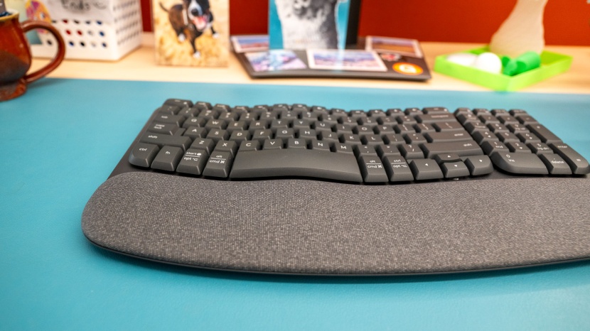 logitech wave keys - the keyboard swells upward toward the middle, simulating some minor...