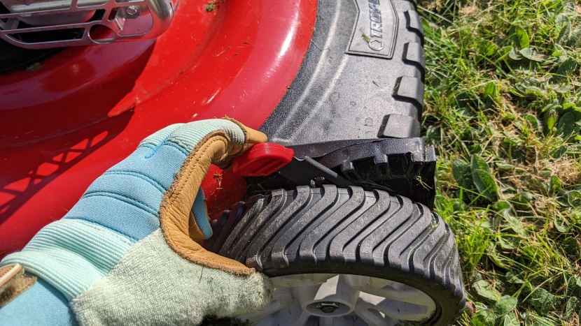 lawn mower - changing the height is generally as easy as moving a couple of...