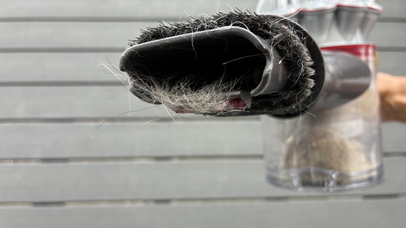 handheld vacuum - the bristles on the brushes tend to cling to hair, meaning you have...