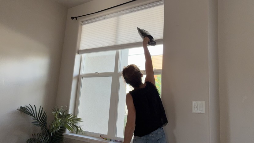 handheld vacuum - the shark's design makes vacuuming overhead easy.