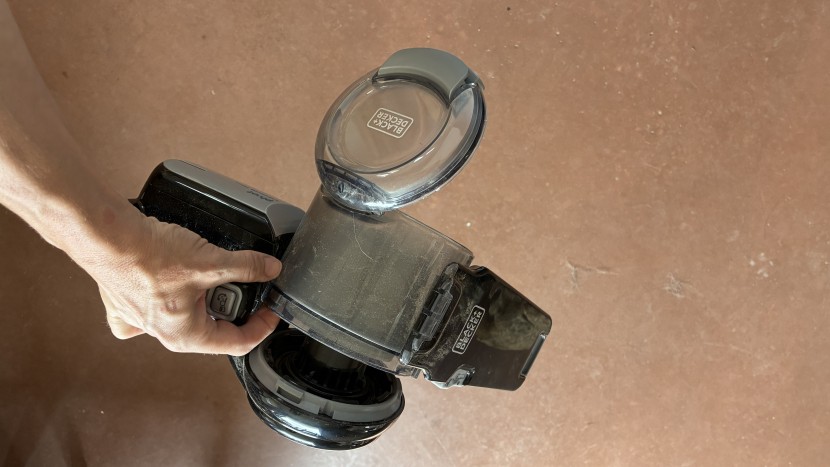 handheld vacuum - the pivot's dust bin system makes it somewhat easy for both sides to...