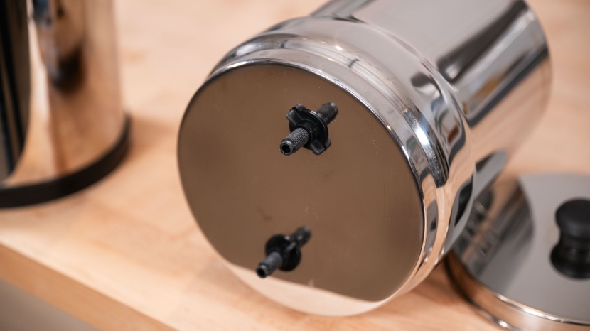 wingnuts screw on the upper tank of the travel berkey to hold the...