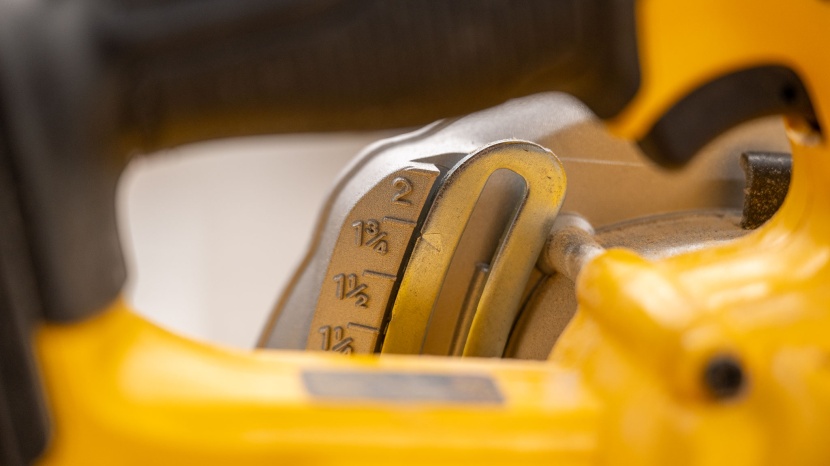 circular saw - peering through the handle of the dewalt dcs391b, you can see the...