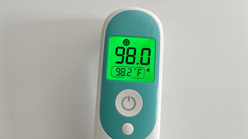 for temperatures below 99.5, the screen lights up green, indicating...